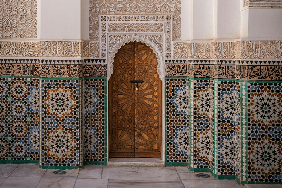 Rich decorated door at Ben Youssef Madrasa in Marrakesh, Morocco